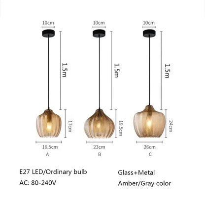 Three amber gray glass pendant lights with ribbed texture and black metal fixtures for modern dining room decorbites amber gray