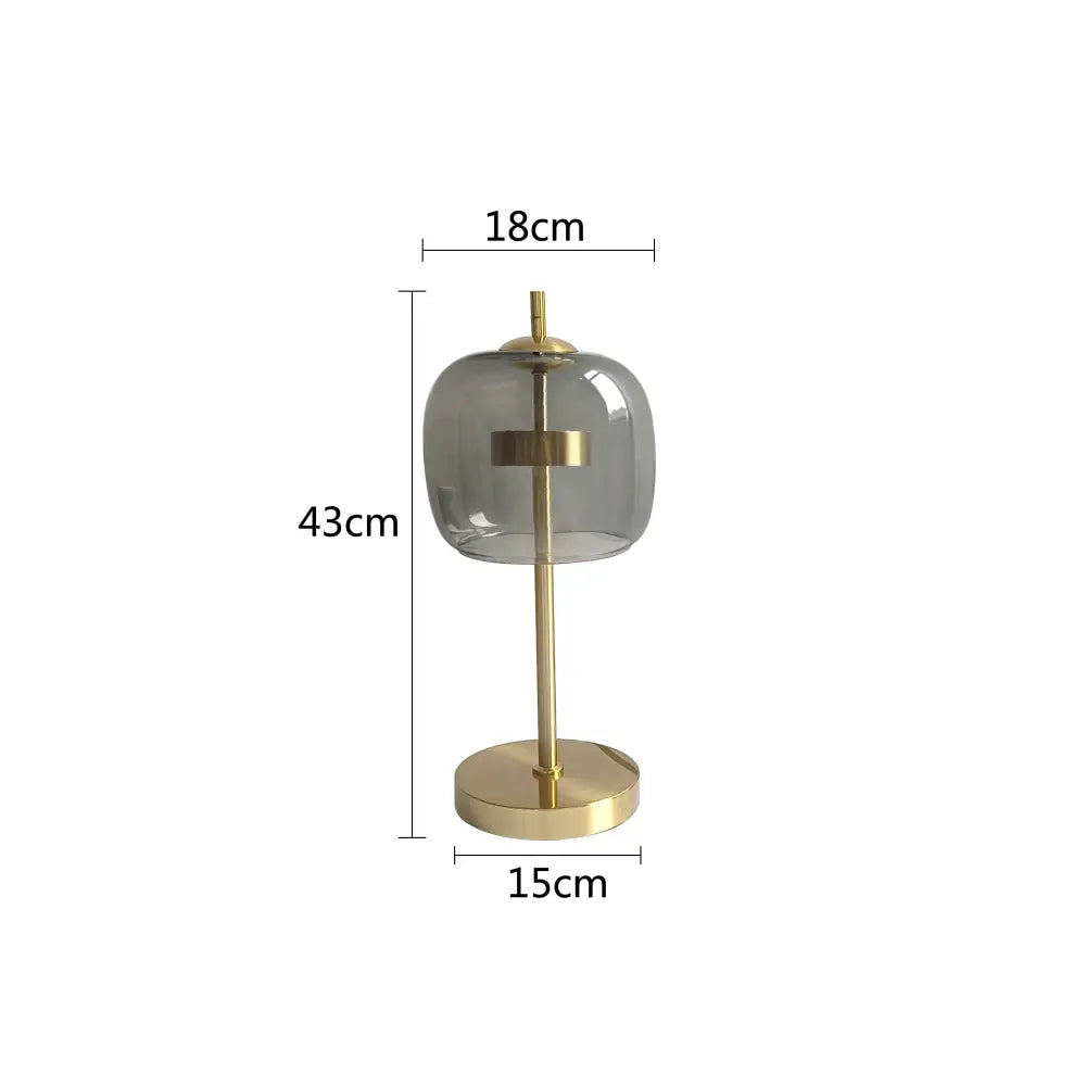 Modern amber and gray decorbites glass table lamp with translucent gray shade and gold-toned metal base for bedroom lighting
