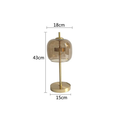 A modern amber and gray glass table lamp with a brass base for bedroom decorbites glass table lighting