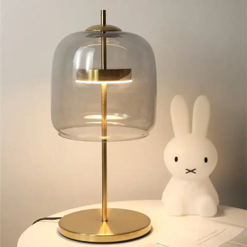Modern amber and gray decorbites glass table lamp with brass finish and translucent dome for bedroom lighting
