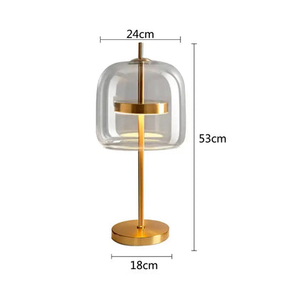 Modern amber and gray decorbites glass table lamp with clear glass dome and gold-toned metal frame for bedroom decor