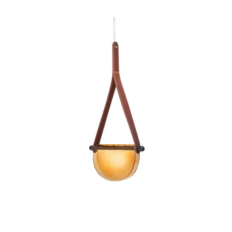 Modern amber and gray handmade leather glass pendant lamp with warm amber glass bowl and brown leather straps for decorbites