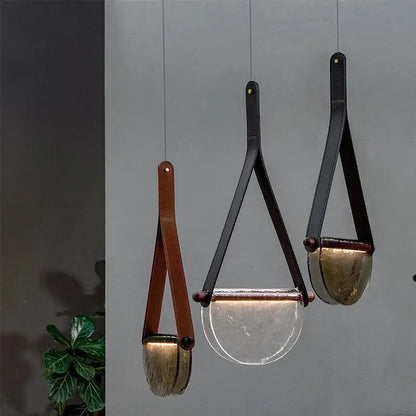Three modern pendant lamps with decorbites handmade leather straps and amber gray glass bowls for bedroom decor