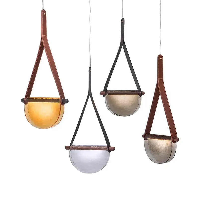 Three hanging pendant lamps with amber and gray handmade leather glass shades featuring brown and black straps for bedroom decorbites handmade leather decor