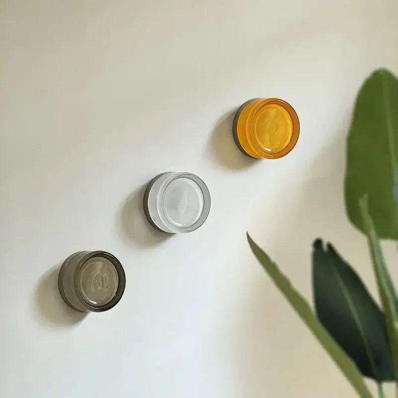 Three circular glass wall sconce holders in amber, clear, and smoky gray tones for decorbites amber jelly led lamp