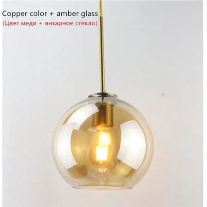 Copper-toned pendant lights with spherical amber glass ball led shade perfect for modern dining room decorbites glass ball