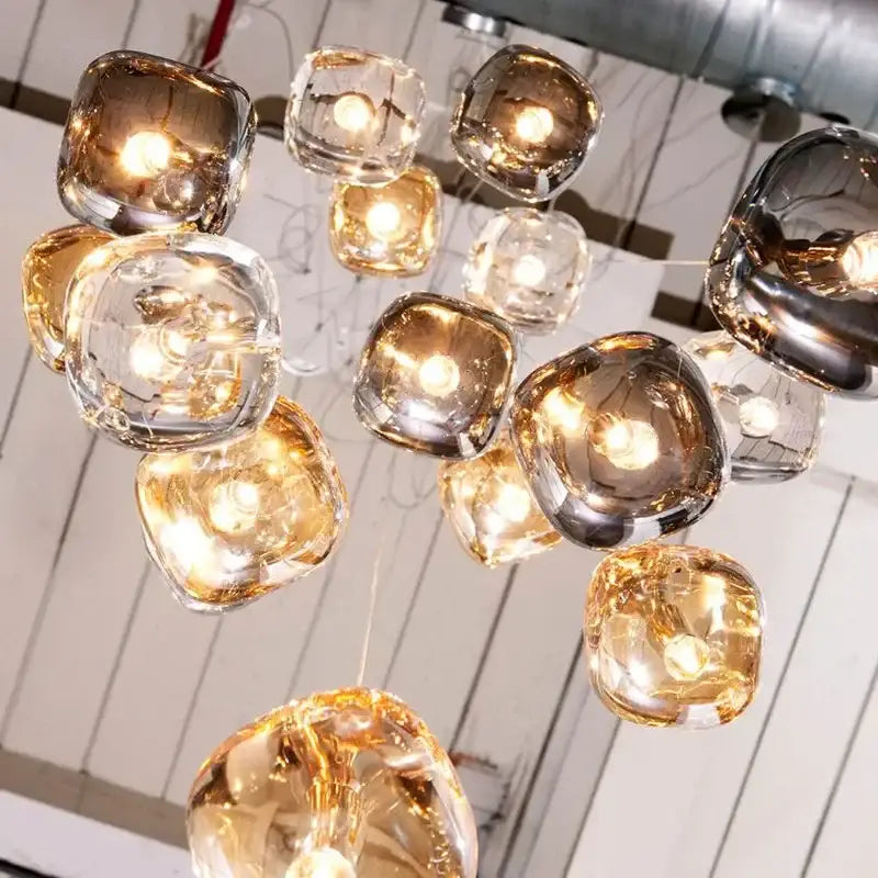 Modern amber and smoky grey crystal staircase chandelier with translucent amber and clear glass globe shades