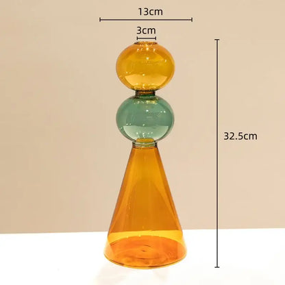 A modern stained glass vase with amber cone base teal spherical middle and golden yellow top for living room decor double glazing stained design