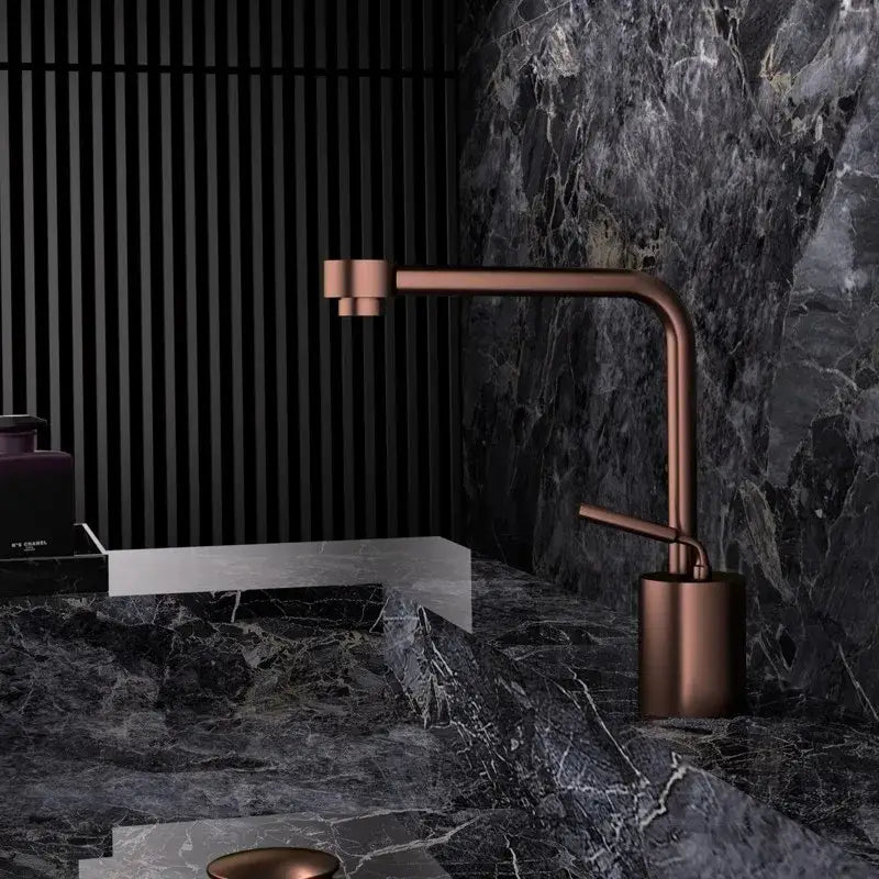 Modern antique bronze bathroom faucet with copper finish curved brass spout and sleek minimalist design
