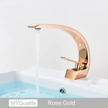 Rose gold modern waterfall basin faucet with sleek curved design and polished brushed gold finish for bathroom mixer