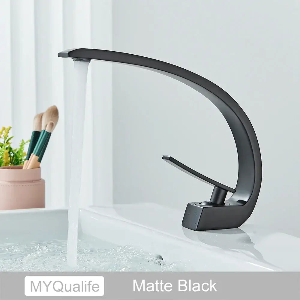 Matte black modern basin faucet with sleek curved design for a contemporary brushed gold basin faucet bathroom mixer