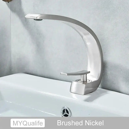 Modern arched brushed gold basin faucet with a sleek brushed nickel curved design for bathroom mixer use