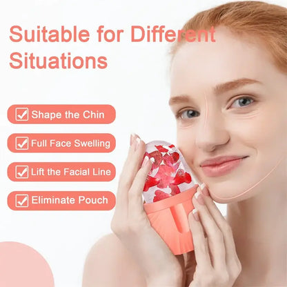 Coral-colored facial roller massager with strawberry-patterned gel top for skin care resembling an ice cube tray design