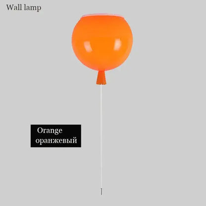 Vibrant orange balloon wall light with a sleek glossy finish and slender white stem for modern bedroom decor