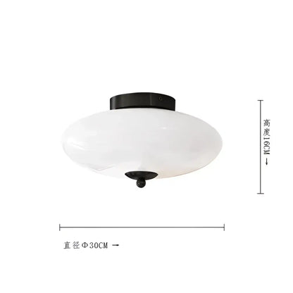 Modern bauhaus cream white glass ceiling lamp with frosted oval shade and black metal mounting for bedroom lighting