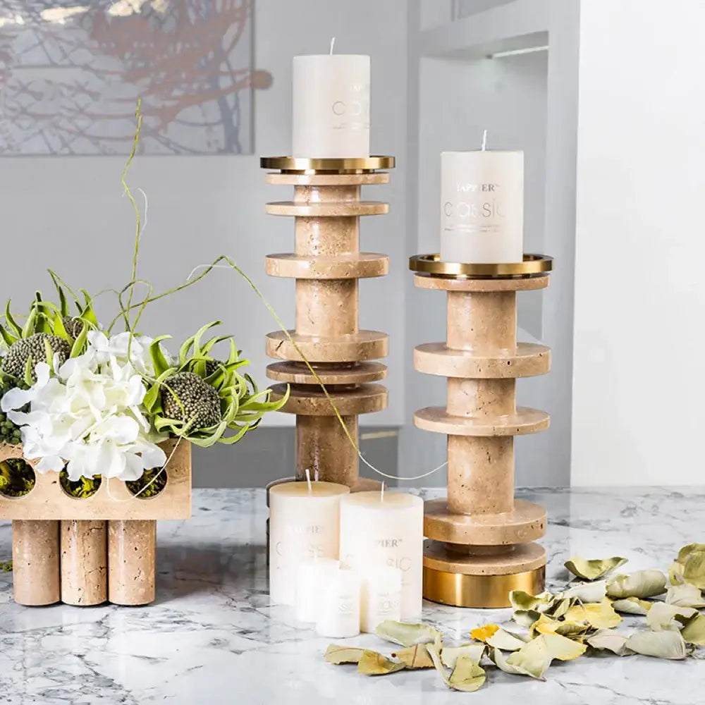 Modern beige and brown travertine candle holder with metal base featuring gold-toned rings for dining room decorbites beige brown