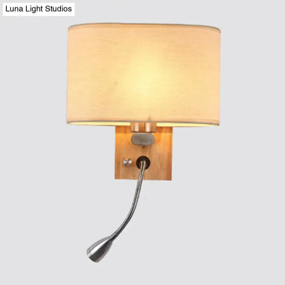 Modern beige fabric bedside reading lamp with warm-toned cylindrical shade and adjustable metallic gooseneck 5 inch fixture