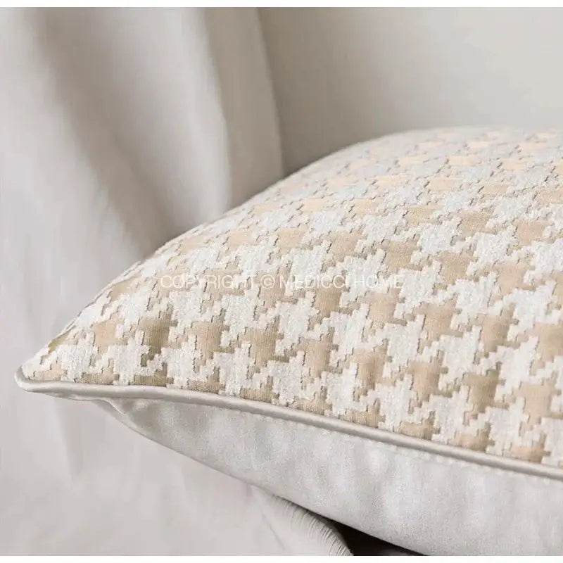Modern beige and gold houndstooth jacquard lumbar pillow with beige and white herringbone textured fabric finish