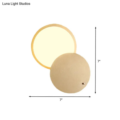Modern beige and gold metal rotatable led wall lamp with circular design and warm diffused glow for bedroom use