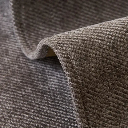 Modern beige and gray chenille sofa cover featuring a textured gray woven rug pattern with subtle herringbone design and stitched edges