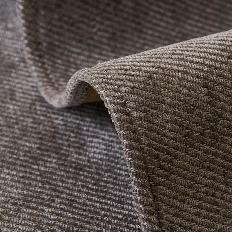 Modern beige and gray chenille sofa cover featuring a textured gray woven rug pattern with subtle herringbone design and stitched edges