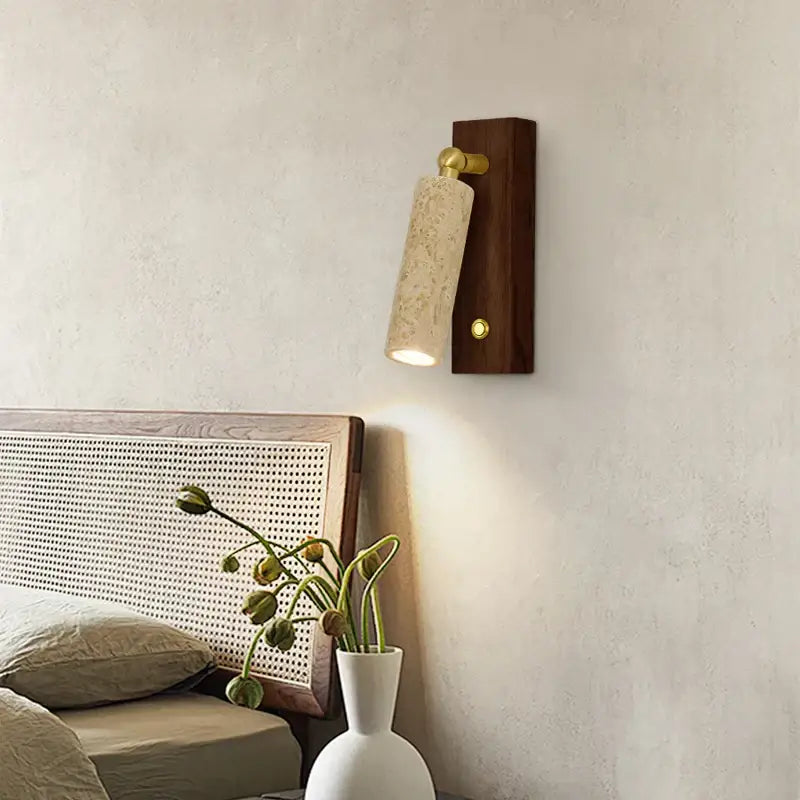 Modern beige travertine copper led wall lamp with textured stone shade and brass accents on dark wood base for bedroom decorbites copper led