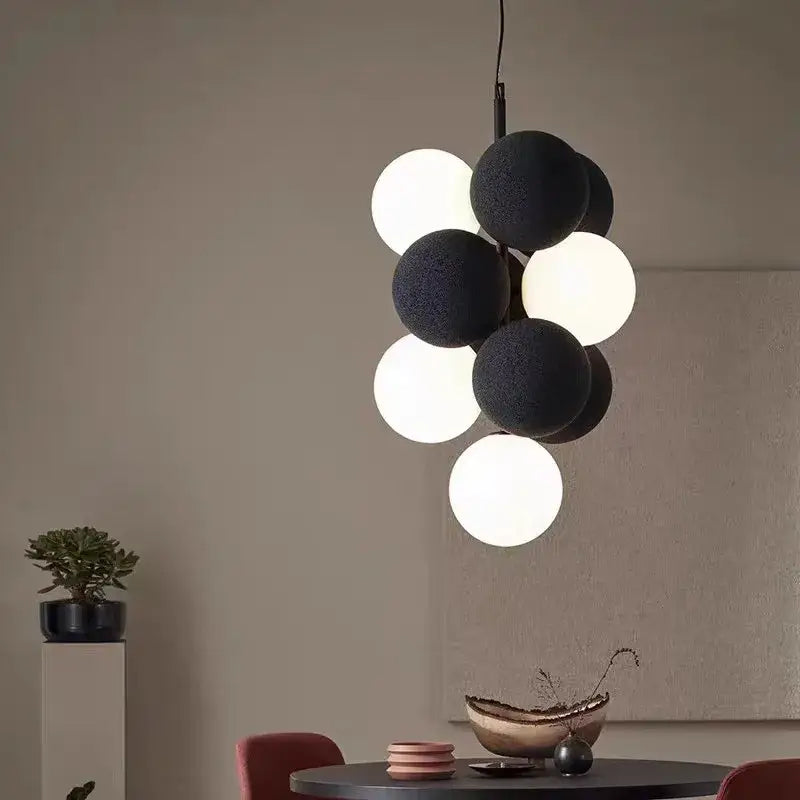Modern black and white spherical pendant lamp with textured matte finish for dining room decorbites abstracta pendant