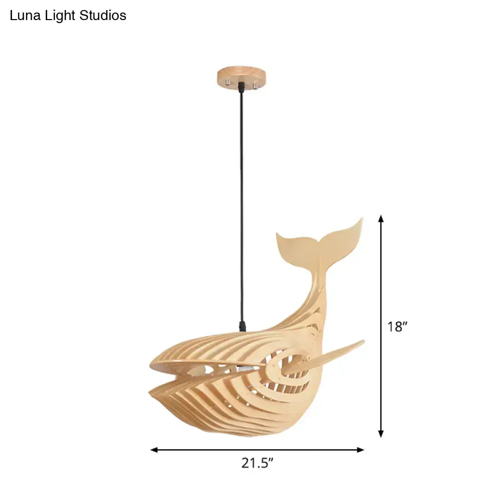 Modern hanging light with a light beige wooden whale design suspended by a black cord for kids bedroom use