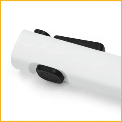 White plastic modern bidet faucet set with black rubberized buttons and textured grip for bathroom use