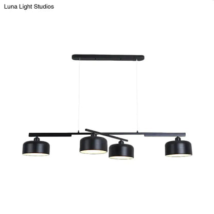 Decorbites™ rotatable chandelier with modern drum shade features four black matte metallic lights hanging from a bar
