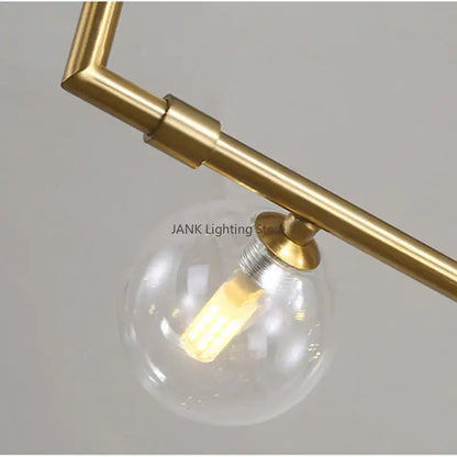 Modern black 7 light glass shade pendant light with brass finish and clear globe glass shade pendant for dining room