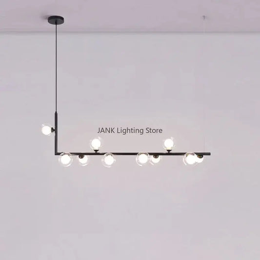 Modern black pendant light with seven clear glass shade globes in a linear design for dining room lighting
