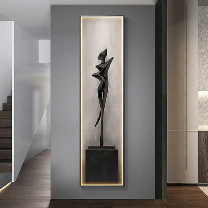 Modern black abstract art led wall lamp featuring a stylized human figure sculpture in an illuminated niche for decorbites decor