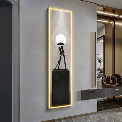 Modern black metal wall lamp featuring decorbites abstract art of a couple under umbrella with warm led lighting