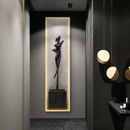 A sleek black abstract art led wall lamp featuring a stylized human figure sculpture for modern living room decor