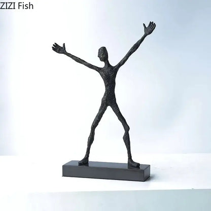 Black textured abstract lovers sculpture with arms outstretched on a rectangular base as a sculpture desk ornament