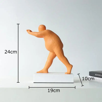 Orange matte-finish abstract resin sculpture figurine in mid-stride on white base for modern home decor
