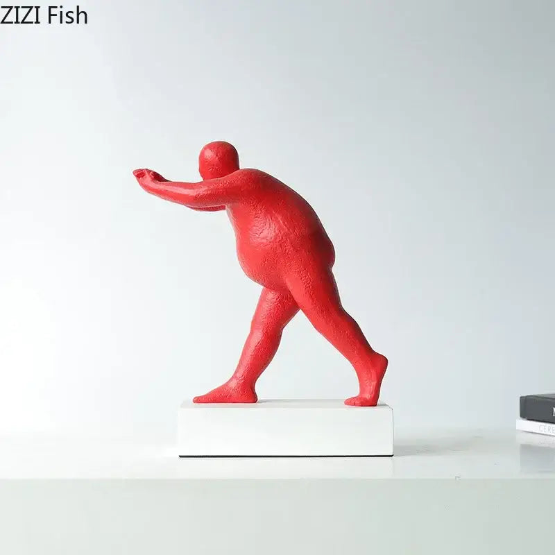 Red textured resin figurine of a stylized human mid-stride pose modern abstract resin sculpture for home decor