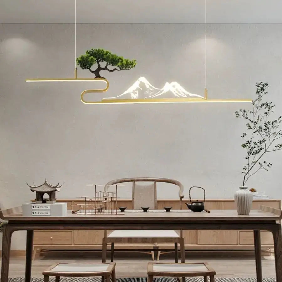 Gold-toned minimalist pendant lights with acrylic mountain peak design illuminate bonsai decorbites living room decor