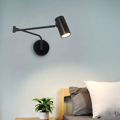 Modern black adjustable acrylic iron led wall lamp with cylindrical head and articulated arm for bedroom reading light