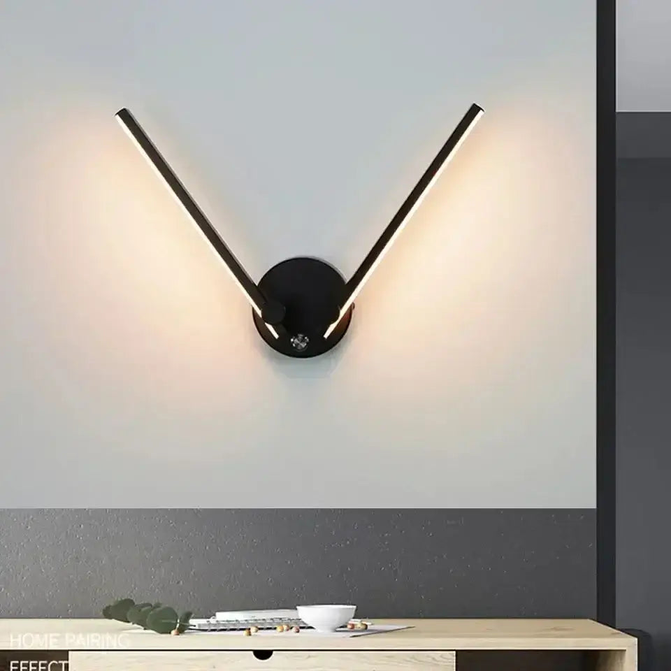 Modern black adjustable double arm wall light with v-shaped led sconce and warm ambient lighting for living room decorbites wall light