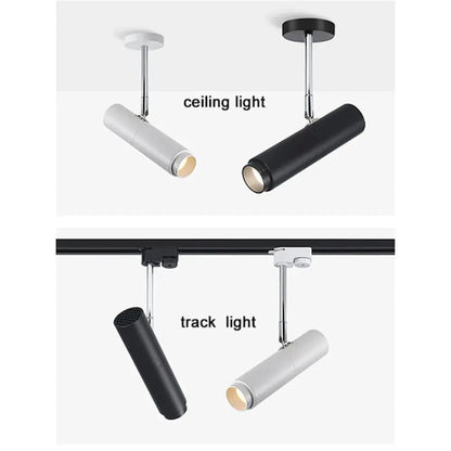 Modern black adjustable focus track lights with sleek cylindrical design and adjustable arms for commercial gallery lighting