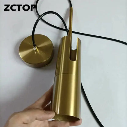 Gold-finished cylindrical pendant light with black cord for modern black adjustable led spotlight chandelier decorbites