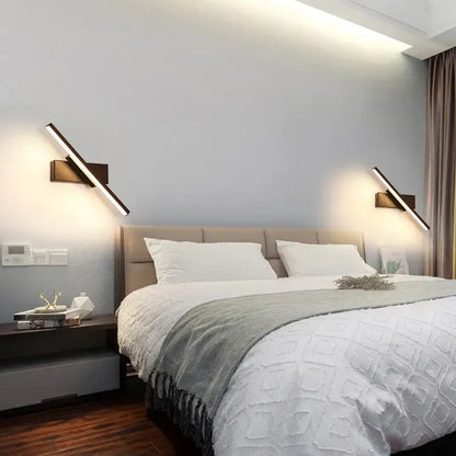 Modern black adjustable led wall sconce with sleek dark bronze finish and integrated led lighting for bedroom use