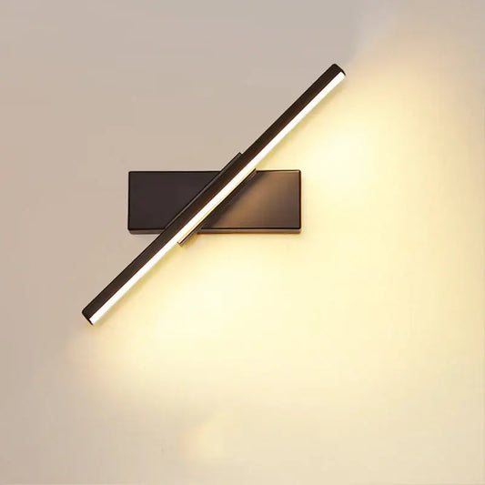 Modern black adjustable led wall sconce with sleek angular design providing warm ambient lighting for bedroom use