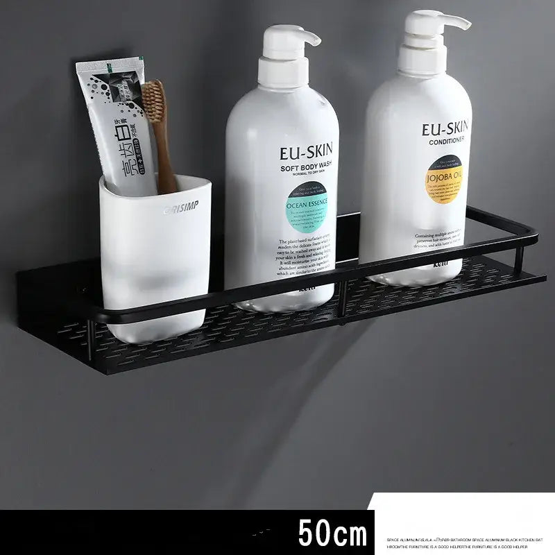 Modern black aluminum bathroom shelf with towel bar featuring textured grid design and three compartments for toiletries