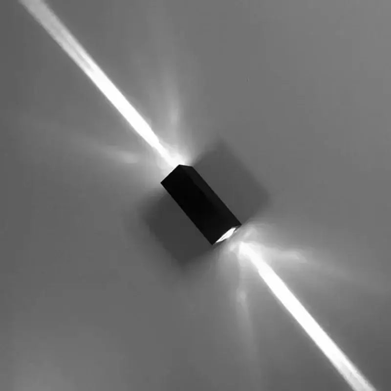 Modern black aluminum waterproof porch spot wall lamp mounted emitting bright focused beams of light