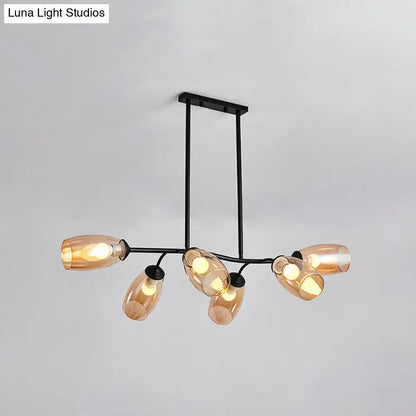 Modern black metal island pendant light with six amber-tinted glass shades and branch design for ceiling mounting