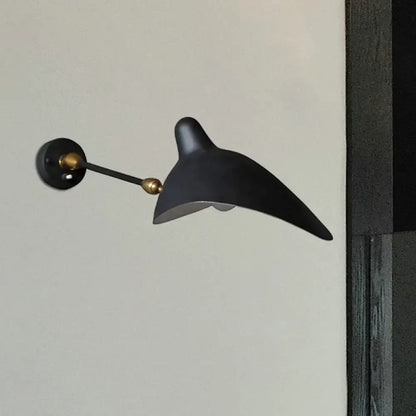 Modern black and brass wall lamp with metallic shade and sleek curved duckbill design for living room fixture height