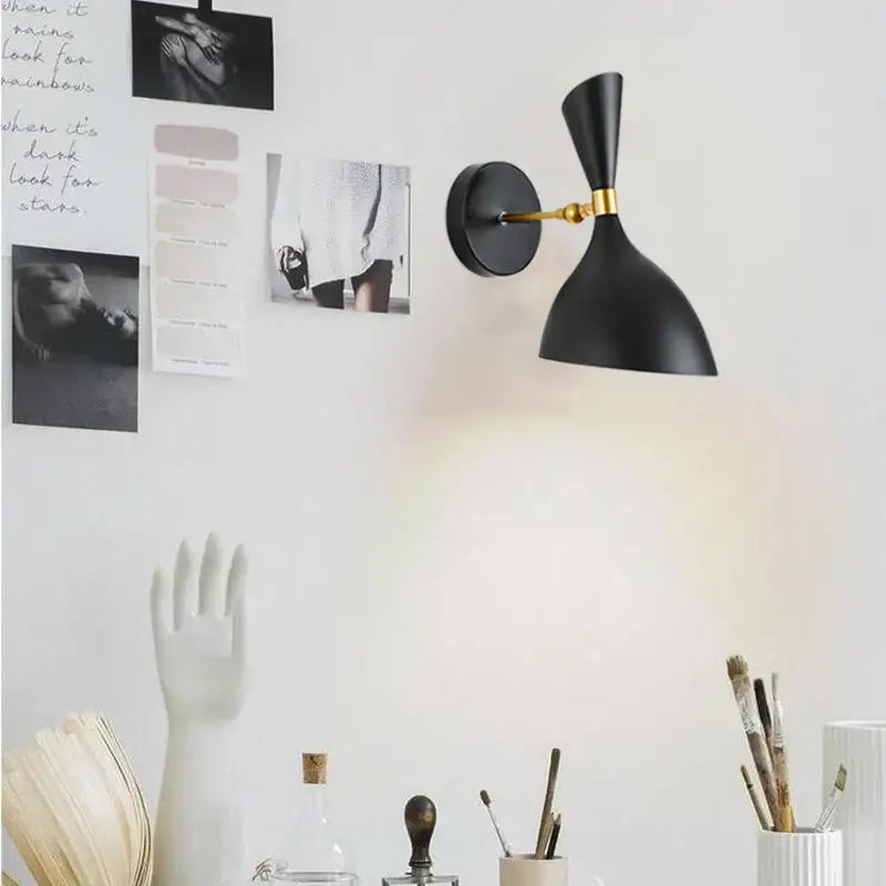 Modern black and brass industrial wall lamp with matte finish and gold accent arm for living room decorbites black white